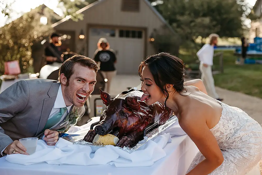 Bride and groom with Rocklands roasted pig
