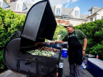 Rocklands Catering team member grilling outside at event