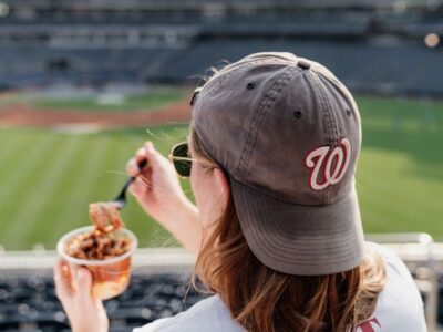 Rocklands-nationals-park-sitting-eating-pearl Woman at Nationals Park baseball game eating Rocklands Pearl in stands