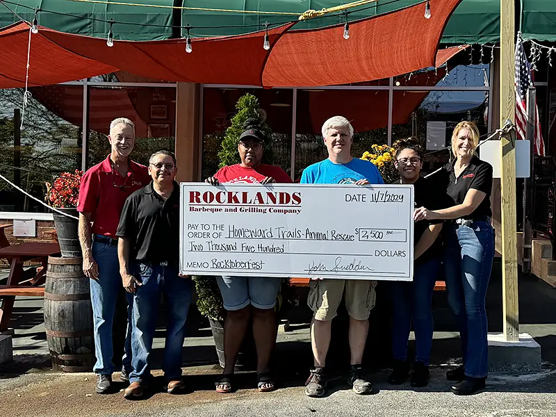 Presenting donation to Homeward Trails Animal Rescue