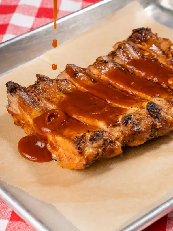 half-baby-rack-with-sauce Sauce dripping on ribs