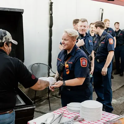 Serving barbeque to DC Firefighters