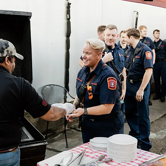 Serving barbeque to DC Firefighters