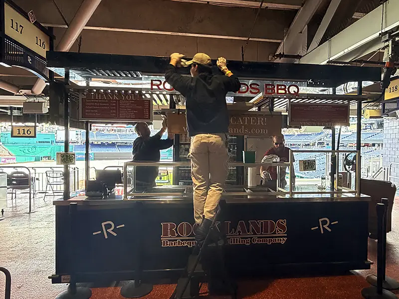 Rocklands employees prep the food stand at Nationals Park.