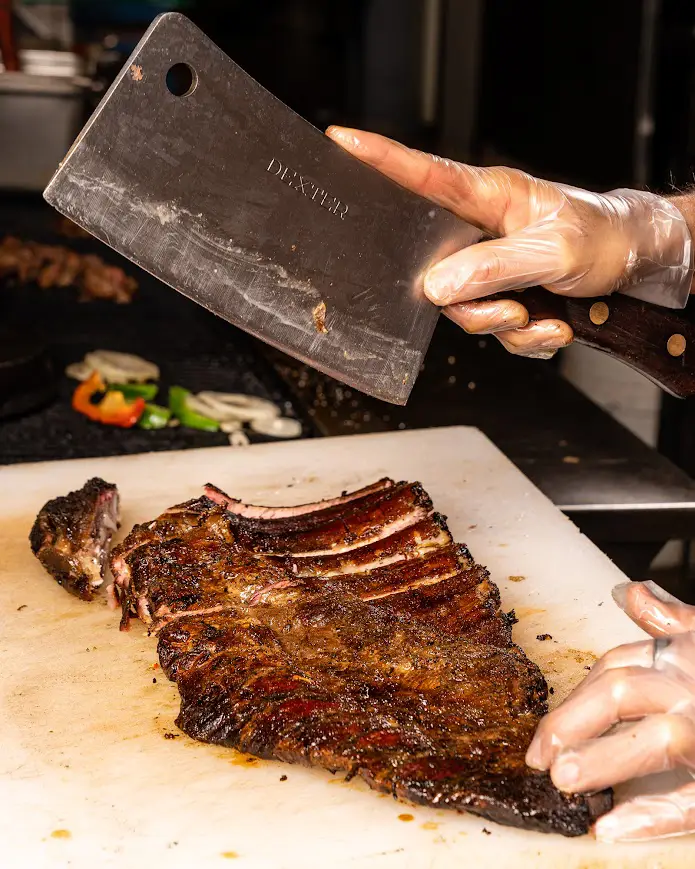 Pit Master chopping Rocklands Spare Ribs