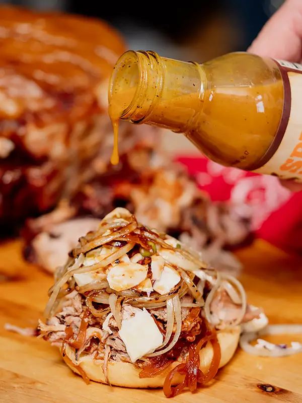 rocklands-spicy-mustard-sauce-pour Spicy Mustard Sauce pouring on sandwich