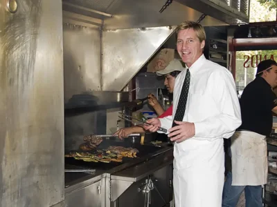 vintage photo of John Snedden at grill